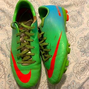 Lime green and blue Nike soccer cleats